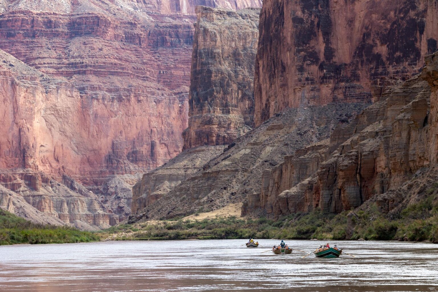 Dories against the massive walls of the Marble Canyon section of Grand Canyon.
