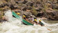 A dory charges through rapids in Grand Canyon