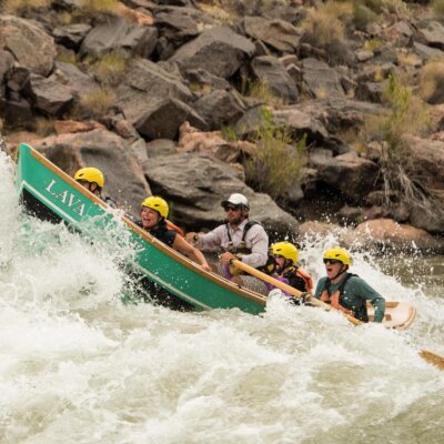 A dory charges through rapids in Grand Canyon
