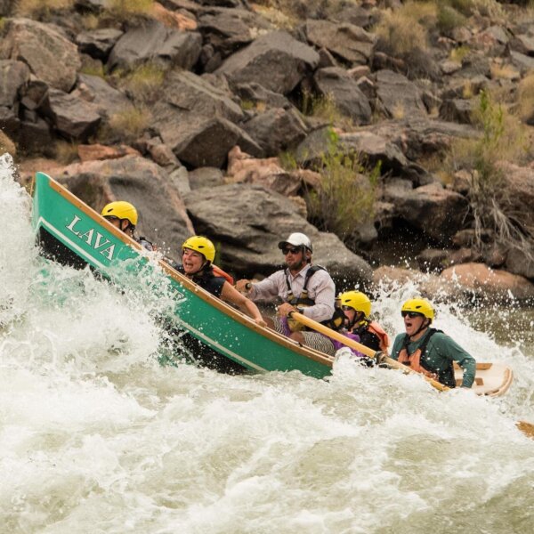 A dory charges through rapids in Grand Canyon