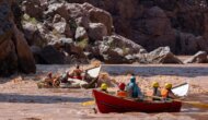A pair of OARS dories going through a rapid on the Colorado River