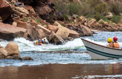 A pair of dories approach one of the rapids in the Upper Grand Canyon.