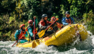 A paddle raft with guides in training go through a rapid on the American River in California