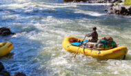 A solo baggage boater rows down the Rogue River in Oregon