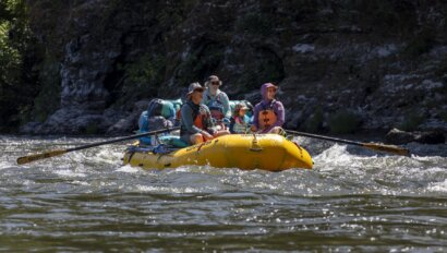 A Grandpa, a child and a Mom raft the Klamath River in 2025.