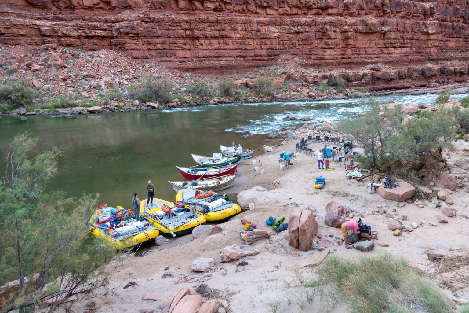 A camp with dories and rafts on the Colorado River through Grand Canyon