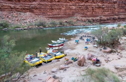 A camp with dories and rafts on the Colorado River through Grand Canyon