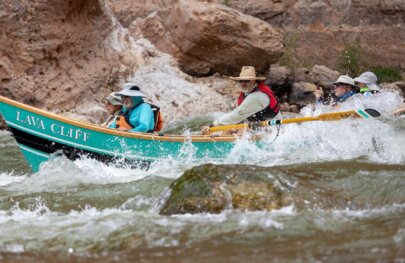 A dory making its way through a small rapid in Grand Canyon