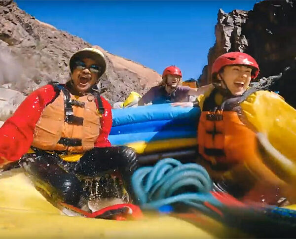 Two rafters in the middle of a whitwater rapid