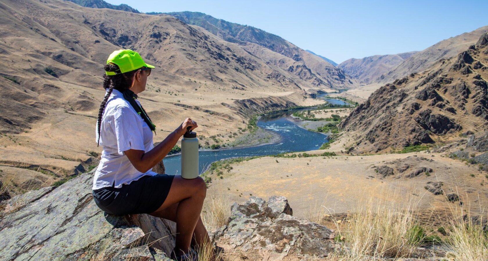A woman rests at an overlook on the Snake River