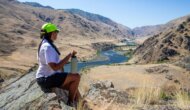 A woman rests at an overlook on the Snake River
