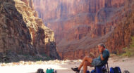 A man reading a book in Grand Canyon