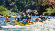 Oar rafts and inflatable kayaks tackle rapids on a family adventure down Oregon's Rogue River with OARS