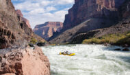 OARS baggage raft drops into Lava Falls with two other rafts wait their turn