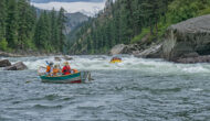 Groups in row boats on the Salmon River in Idaho.