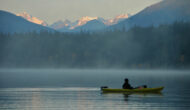 Calm misty morning on a lake in Canada.