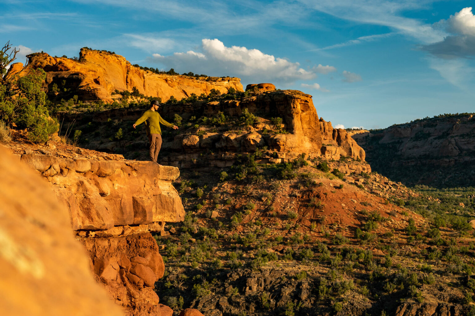 Person standing on top of a rocks in Colorado.