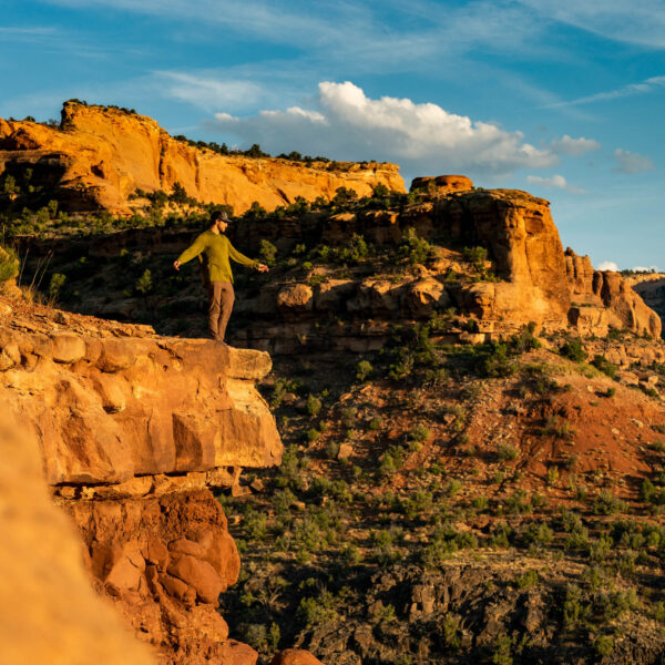 Person standing on top of a rocks in Colorado.