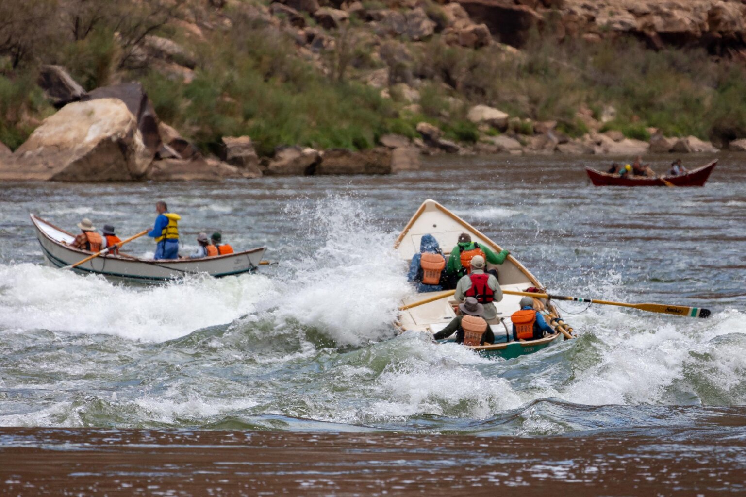 Dories make their way through a small rapid in Grand Canyon.