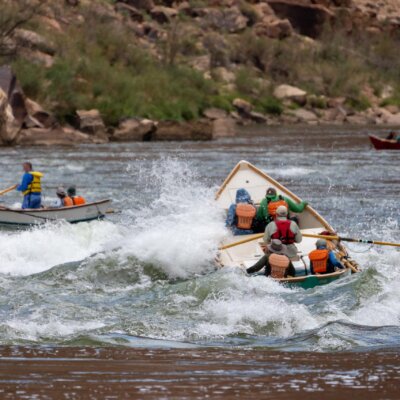 Dories make their way through a small rapid in Grand Canyon.