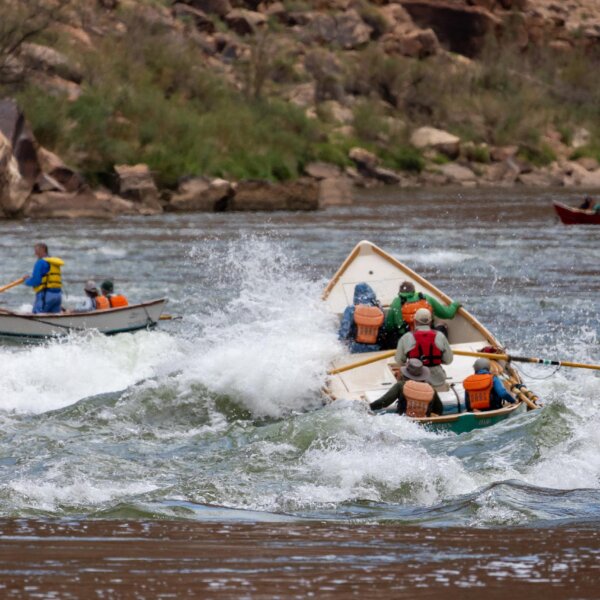 Dories make their way through a small rapid in Grand Canyon.