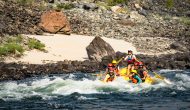 An OARS raft goes through a rapid on the Lower Salmon River