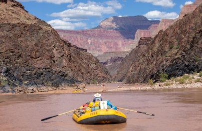 A rafter floats down the Grand Canyon on the Colorado River