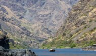 A dory rows down a scenic section of the Snake River in Hells Canyon, Idaho