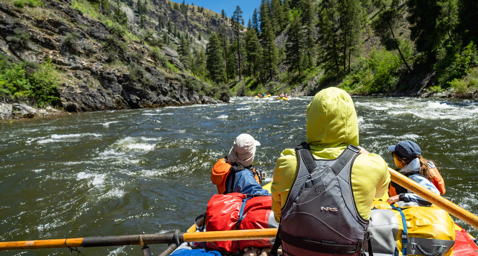 View from behind guide while rowing on the Middle Fork of the Salmon River in Idaho