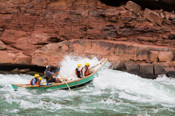 A sleek, rigid boats built from fiberglass, wood and foam, known as a dory