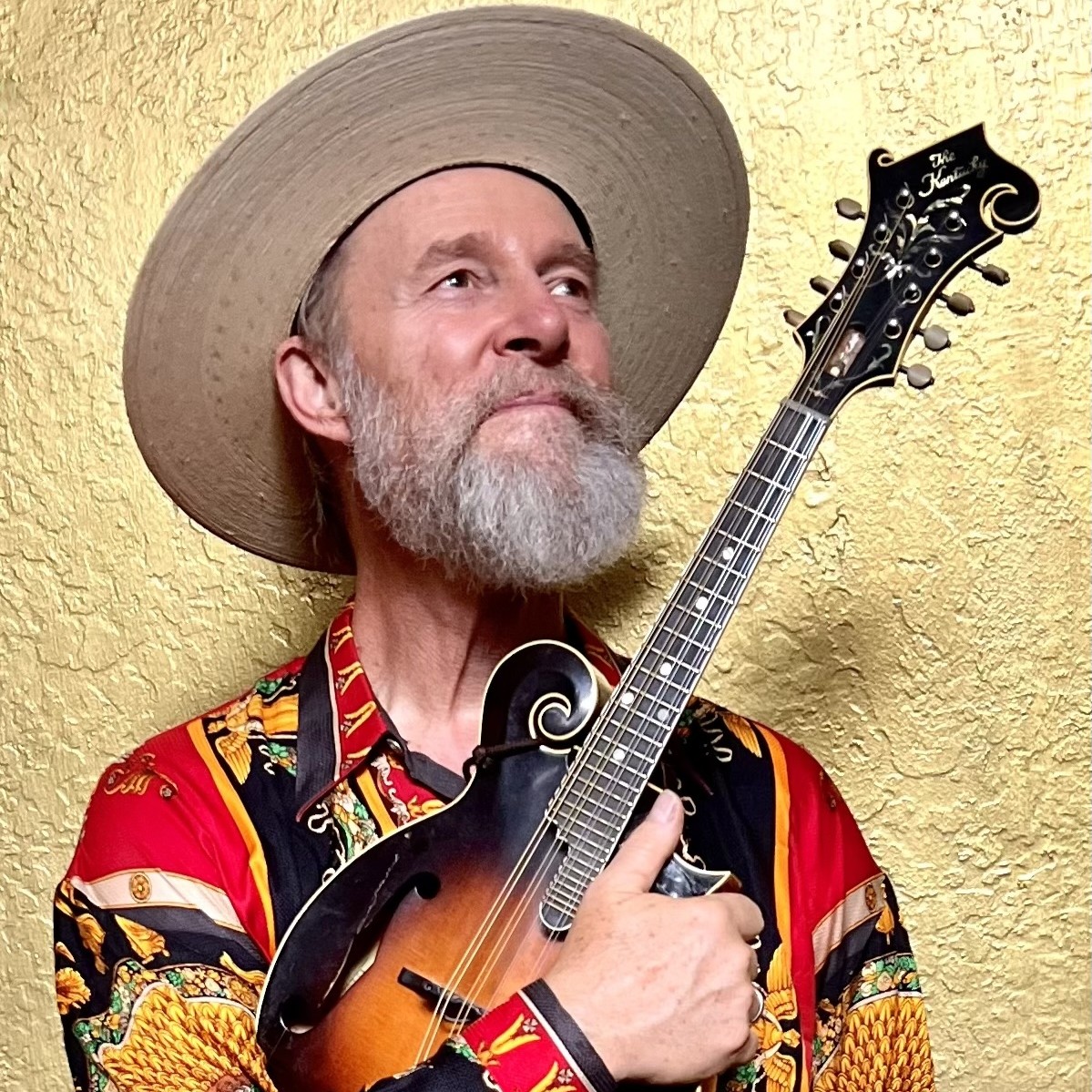 Joe Craven poses with his mandolin