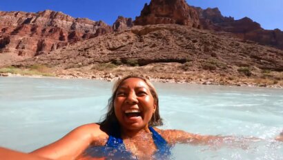 A woman swimming in the turquoose waters of the Little Colorado